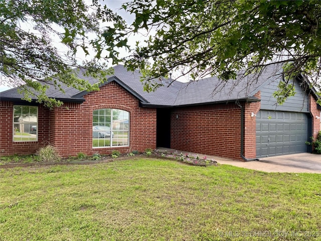 11762 N 156th E Ave, Collinsville, OK 74021 - single story home featuring brick siding, a garage, concrete driveway, and a front yard