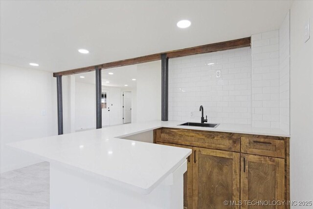 62 Jolene Reid Rd, Mead, OK 73449 - bar featuring decorative backsplash, wet bar, recessed lighting, and a sink