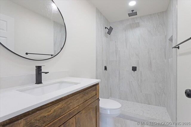 62 Jolene Reid Rd, Mead, OK 73449 - bathroom with visible vents, tiled shower, toilet, and vanity