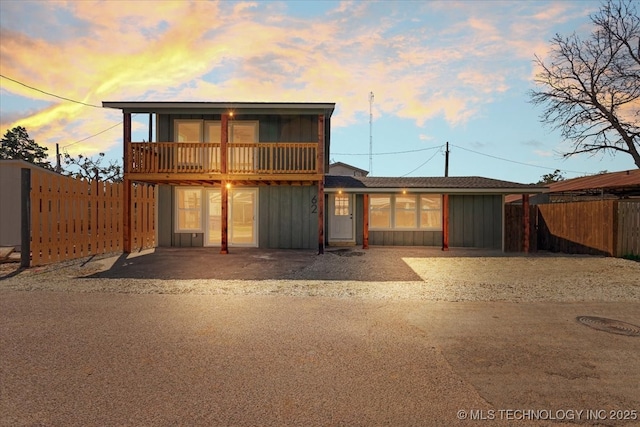 62 Jolene Reid Rd, Mead, OK 73449 - back of property with a patio area, board and batten siding, and a fenced backyard