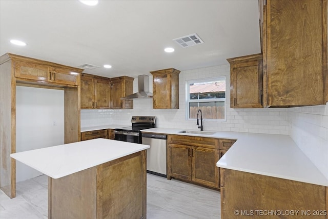 62 Jolene Reid Rd, Mead, OK 73449 - kitchen featuring a sink, wall chimney exhaust hood, visible vents, and stainless steel appliances