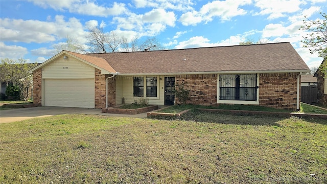 single story home with a front yard, a vegetable garden, concrete driveway, a garage, and brick siding