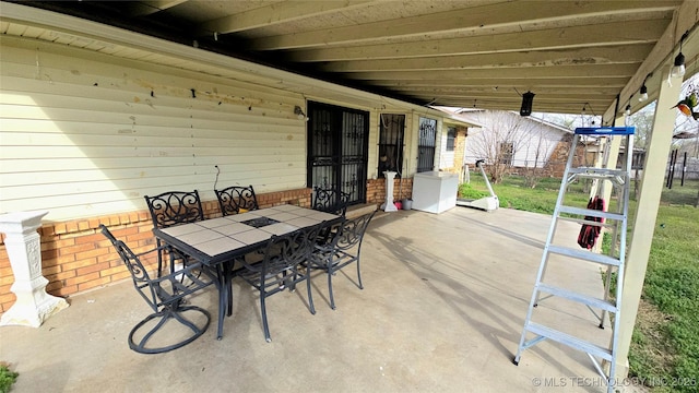 view of patio featuring outdoor dining space