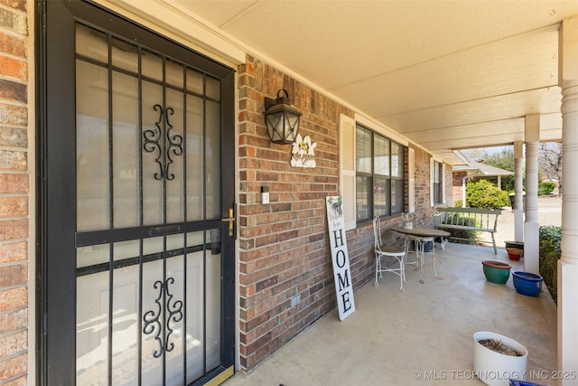 401 S 14th, Ada, OK 74820 - property entrance with covered porch and brick siding