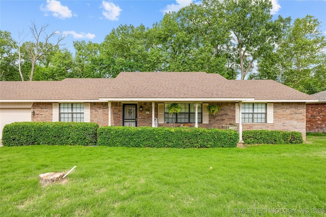 401 S 14th, Ada, OK 74820 - ranch-style home with a front yard, an attached garage, brick siding, and covered porch