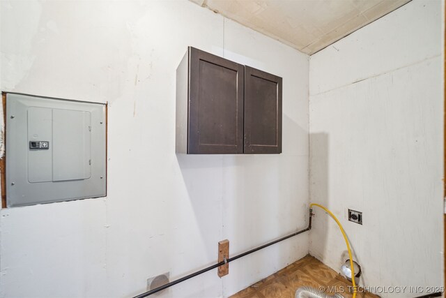 interior space with electric panel and cabinet space