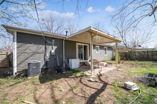 back of property featuring cooling unit, a patio, and fence