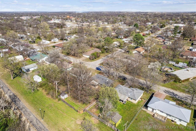 birds eye view of property with a residential view