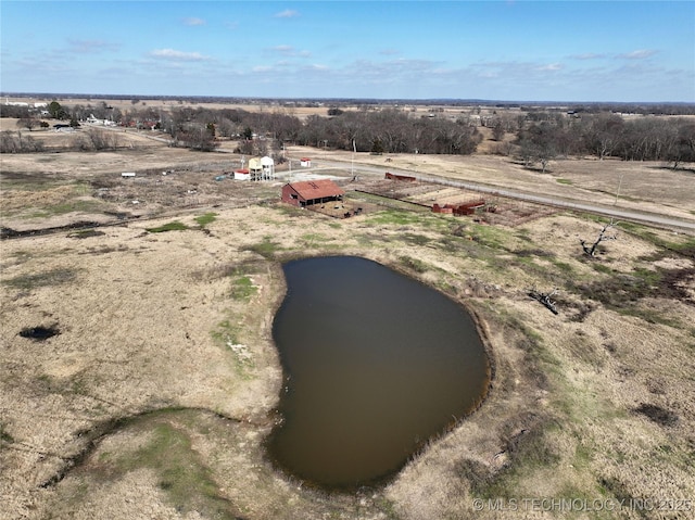 drone / aerial view with a water view and a rural view