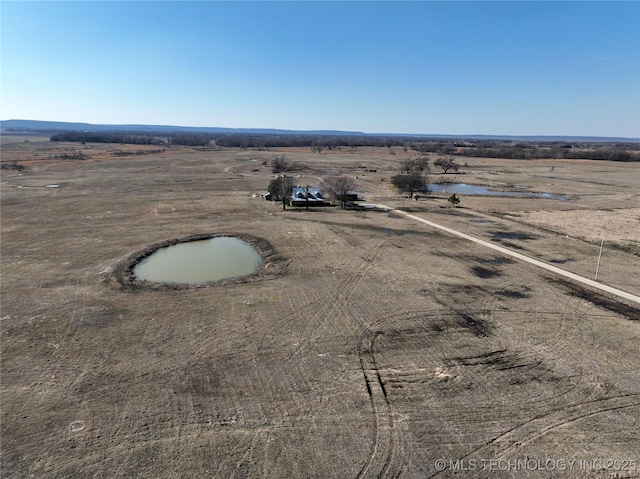 birds eye view of property with a rural view and a water view