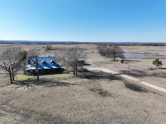 birds eye view of property with a rural view