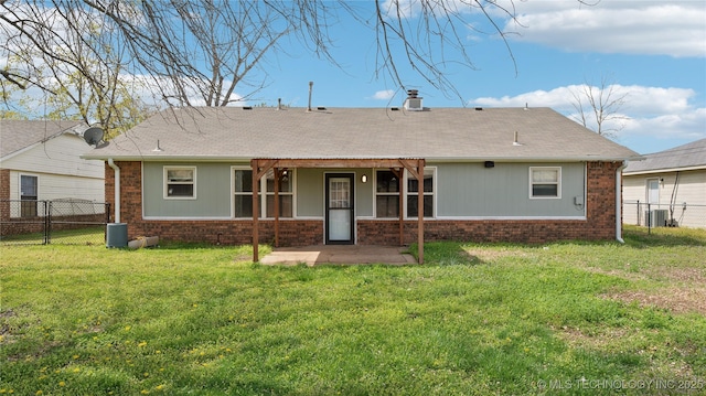 313 S Fairfax Ave, Skiatook, OK 74070 - rear view of property featuring a shingled roof, fence, cooling unit, and a yard