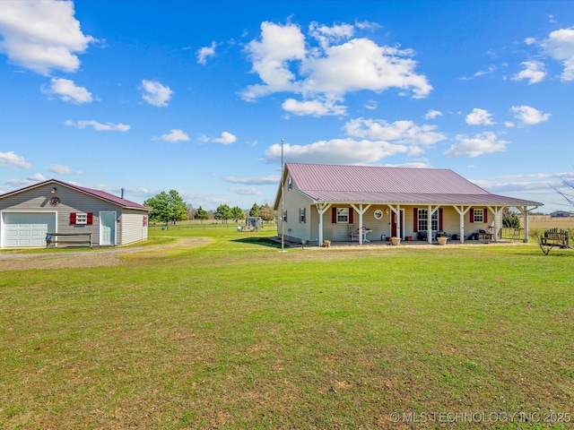 9097 N 50th W St, Sperry, OK 74073 - farmhouse with covered porch, a front yard, metal roof, driveway, and a detached garage