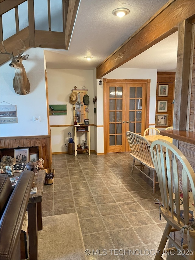 9097 N 50th W St, Sperry, OK 74073 - dining space featuring beam ceiling and a textured ceiling