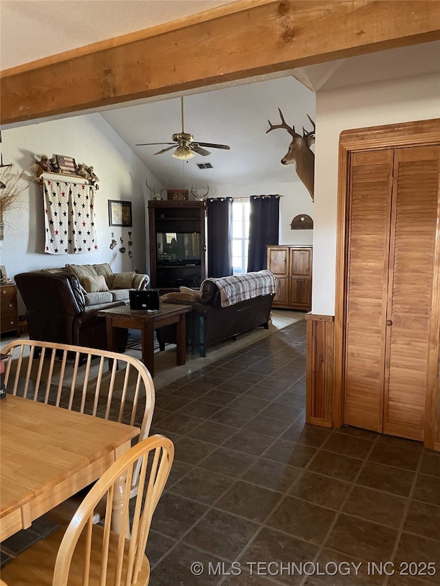 9097 N 50th W St, Sperry, OK 74073 - living room featuring a ceiling fan and dark tile patterned floors