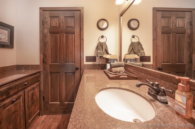 358653 E 5700th Rd, Jennings, OK 74038 - bathroom featuring vanity and wood finished floors