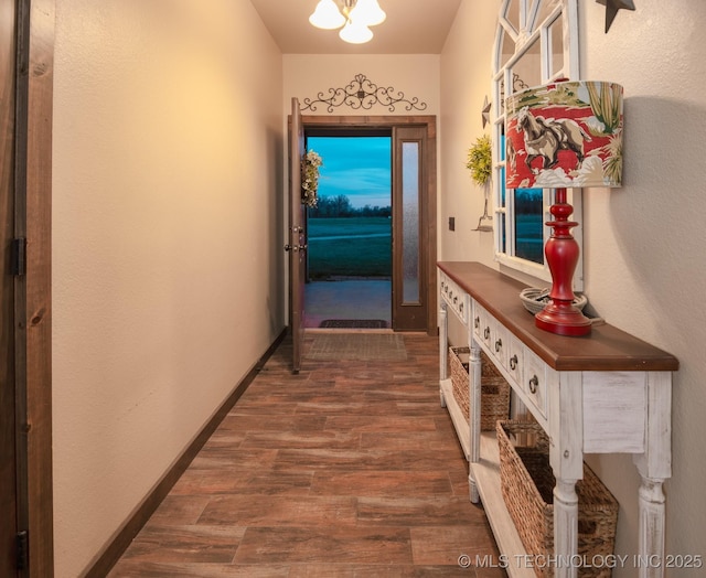 358653 E 5700th Rd, Jennings, OK 74038 - doorway to outside with dark wood finished floors and baseboards