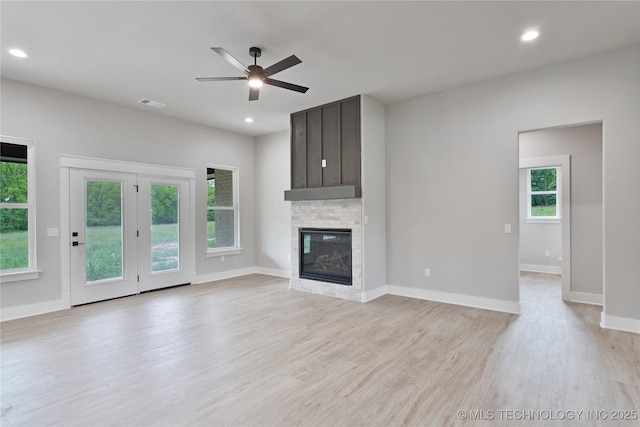 3995 Folsom Rd, Durant, OK 74701 - unfurnished living room with light wood finished floors, a ceiling fan, baseboards, recessed lighting, and a glass covered fireplace