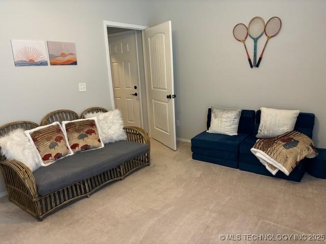 142 Elm St, Mannford, OK 74044 - living area with carpet floors