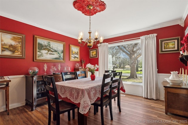 108 S Bettes Ave, Wagoner, OK 74467 - dining room featuring baseboards, crown molding, wood finished floors, and an inviting chandelier