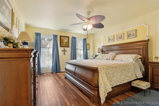 108 S Bettes Ave, Wagoner, OK 74467 - bedroom with wood finished floors and ceiling fan
