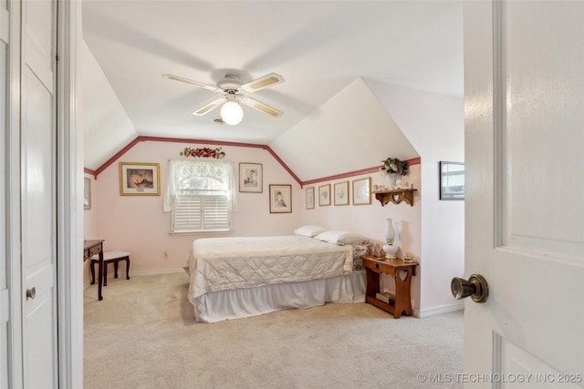108 S Bettes Ave, Wagoner, OK 74467 - bedroom featuring light colored carpet, vaulted ceiling, ceiling fan, and baseboards