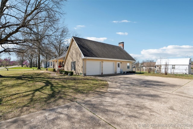 108 S Bettes Ave, Wagoner, OK 74467 - view of side of home featuring fence, a chimney, a garage, driveway, and a yard