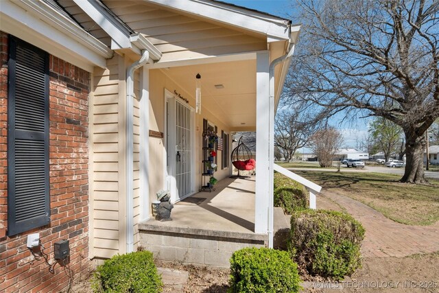 108 S Bettes Ave, Wagoner, OK 74467 - exterior space with covered porch and brick siding
