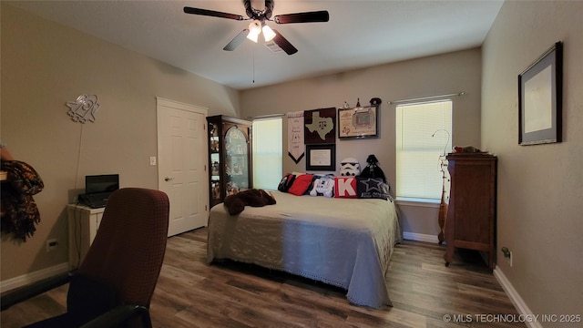 6111 County Road 3605, Ada, OK 74820 - bedroom featuring dark wood finished floors, baseboards, and ceiling fan
