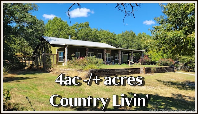 6111 County Road 3605, Ada, OK 74820 - view of front of home featuring a front yard and metal roof