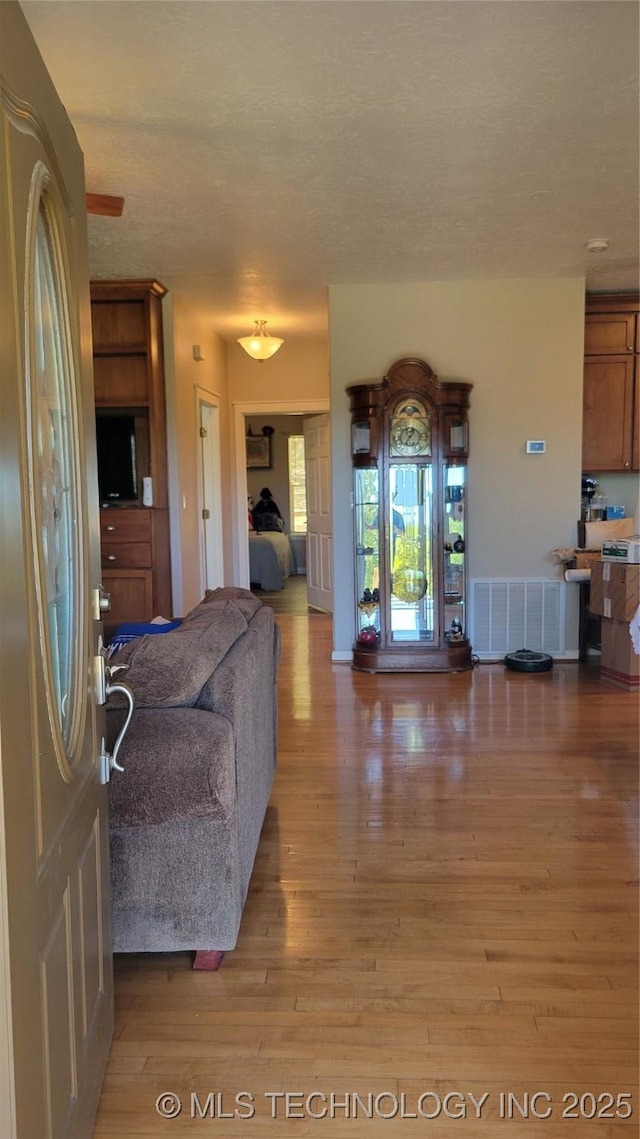 6111 County Road 3605, Ada, OK 74820 - living room with visible vents and wood finished floors