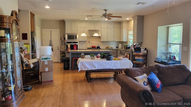 6111 County Road 3605, Ada, OK 74820 - kitchen featuring open floor plan, ceiling fan, visible vents, and appliances with stainless steel finishes