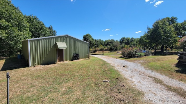 6111 County Road 3605, Ada, OK 74820 - view of pole building with driveway and a yard
