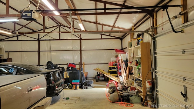 6111 County Road 3605, Ada, OK 74820 - garage featuring metal wall and a garage door opener