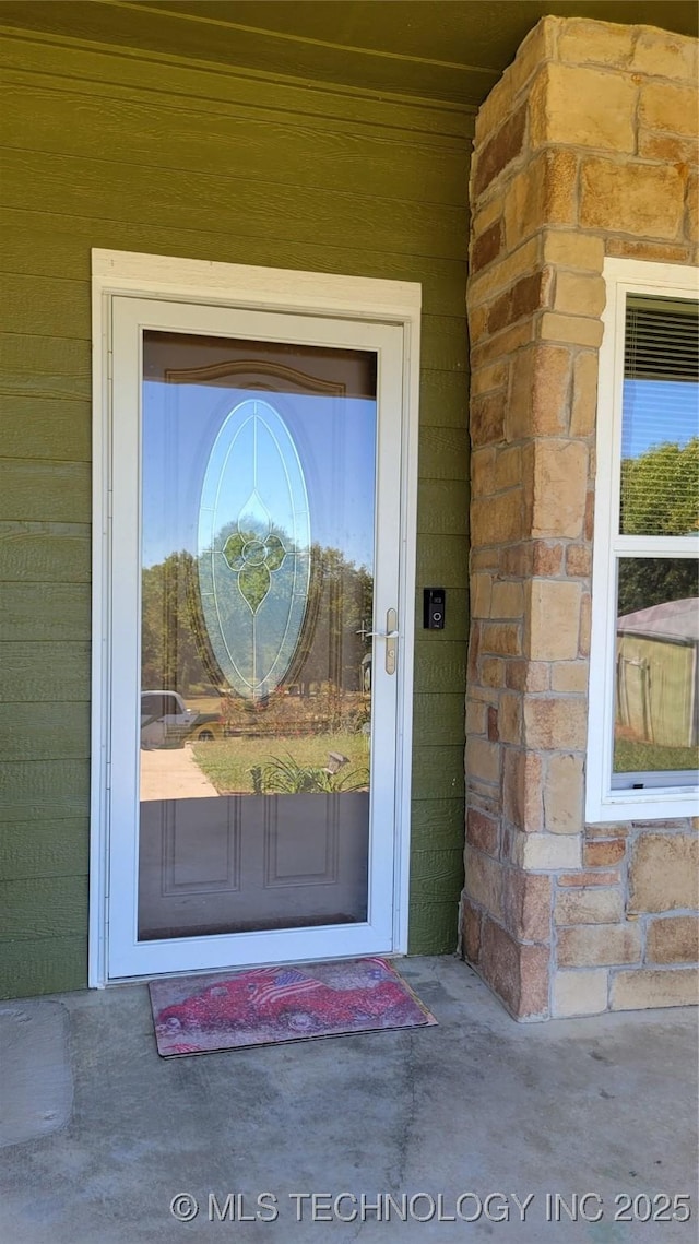 6111 County Road 3605, Ada, OK 74820 - property entrance featuring stone siding