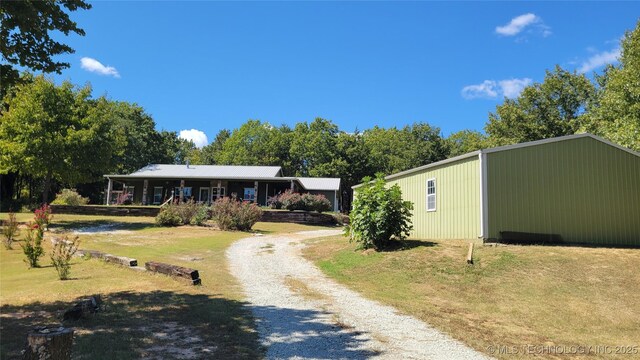 6111 County Road 3605, Ada, OK 74820 - view of front facade with driveway and a front lawn