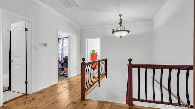 76 Cris, Durant, OK 74701 - hall with an upstairs landing, light wood-style floors, ornamental molding, and baseboards