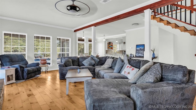 76 Cris, Durant, OK 74701 - living room with crown molding, light wood-style flooring, stairway, and baseboards