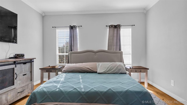 76 Cris, Durant, OK 74701 - bedroom with crown molding, light wood-style floors, and baseboards