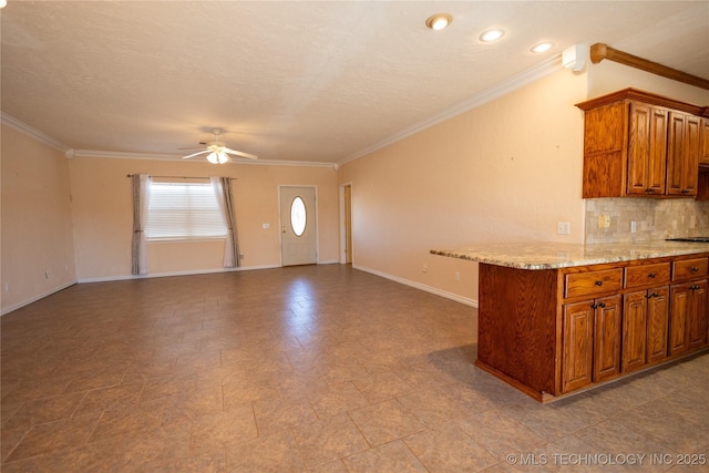 2 Aspen, Davis, OK 73030 - kitchen featuring ornamental molding, baseboards, decorative backsplash, ceiling fan, and brown cabinets