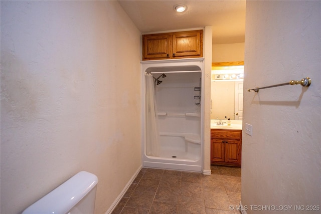2 Aspen, Davis, OK 73030 - bathroom with vanity, baseboards, toilet, and a shower stall
