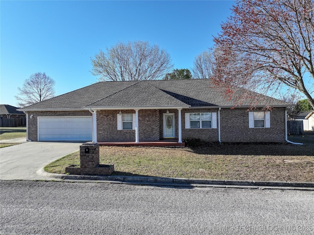 ranch-style home with brick siding, concrete driveway, a garage, and a front lawn