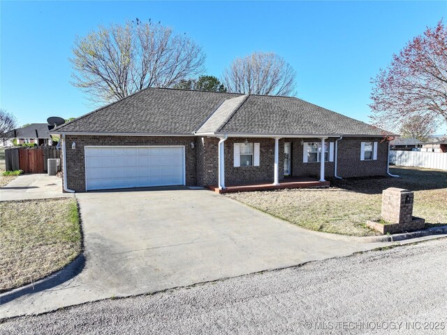 2 Aspen, Davis, OK 73030 - ranch-style house featuring fence, driveway, covered porch, brick siding, and a garage