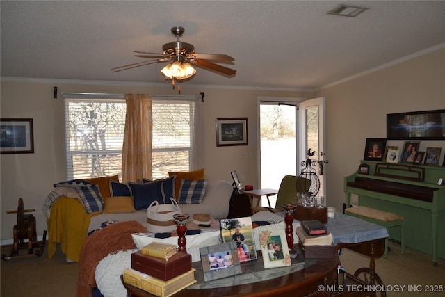 17414 Bridgeview Rd, Madill, OK 73446 - carpeted dining area with ceiling fan, visible vents, and crown molding