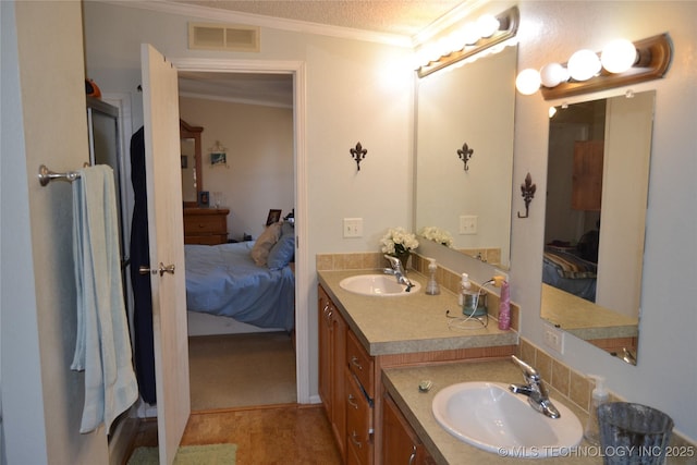 17414 Bridgeview Rd, Madill, OK 73446 - ensuite bathroom with a textured ceiling, visible vents, connected bathroom, ornamental molding, and vanity
