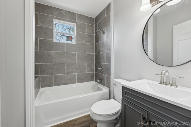 719 S 7th St, Muskogee, OK 74401 - bathroom with vanity, bathing tub / shower combination, and wood finished floors