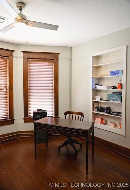 home office with wood finished floors, ceiling fan, baseboards, and built in features