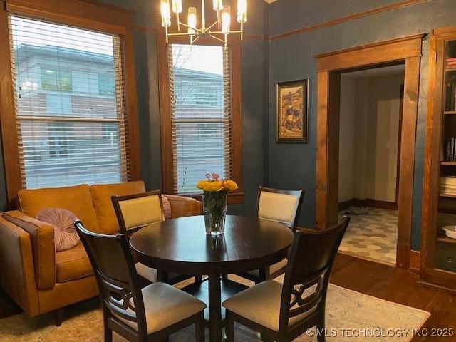 dining area with a chandelier and light wood finished floors