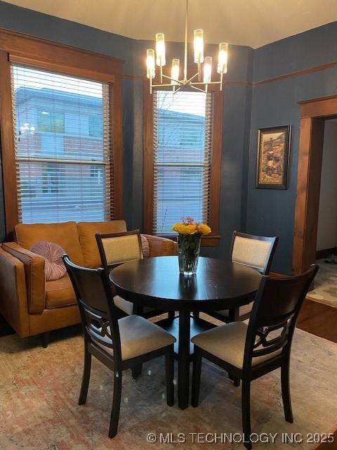 dining room with a chandelier and light wood-style floors