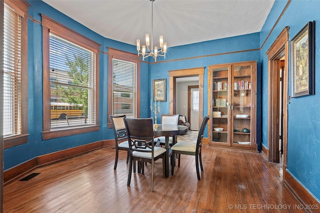 121 F SW, Ardmore, OK 73401 - dining room with a chandelier, hardwood / wood-style floors, plenty of natural light, and a textured wall